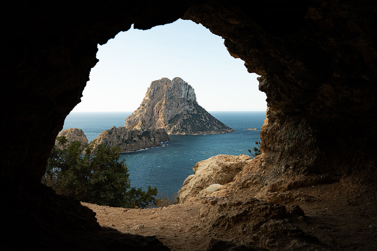 Postcard fine art Es Vedrà Cave en Ibiza por Sofía Gómez-Fonzo, vista del islote desde una cueva en la costa