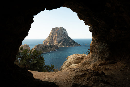Postcard fine art Es Vedrà Cave en Ibiza por Sofía Gómez-Fonzo, vista del islote desde una cueva en la costa